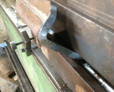 An image of us using the brake press