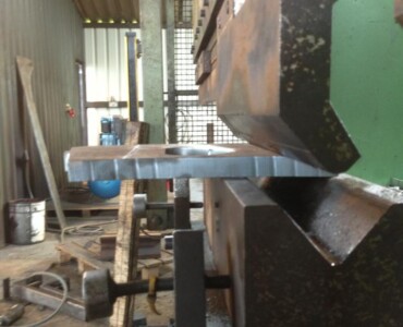 An image of us using the brake press